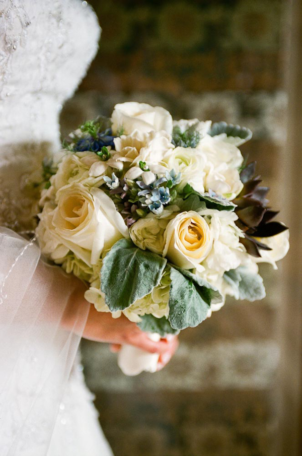 Bridal bouquet with white flowers and green succulent accents - wedding photo by top Austin based wedding photographers Q Weddings